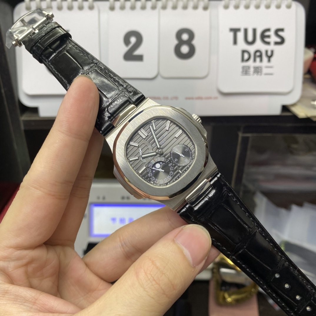 Patek Philippe Nautilus series 5712G-001, Stainless Steel Case Grey Dial Black Leather Strap, 40mm size.