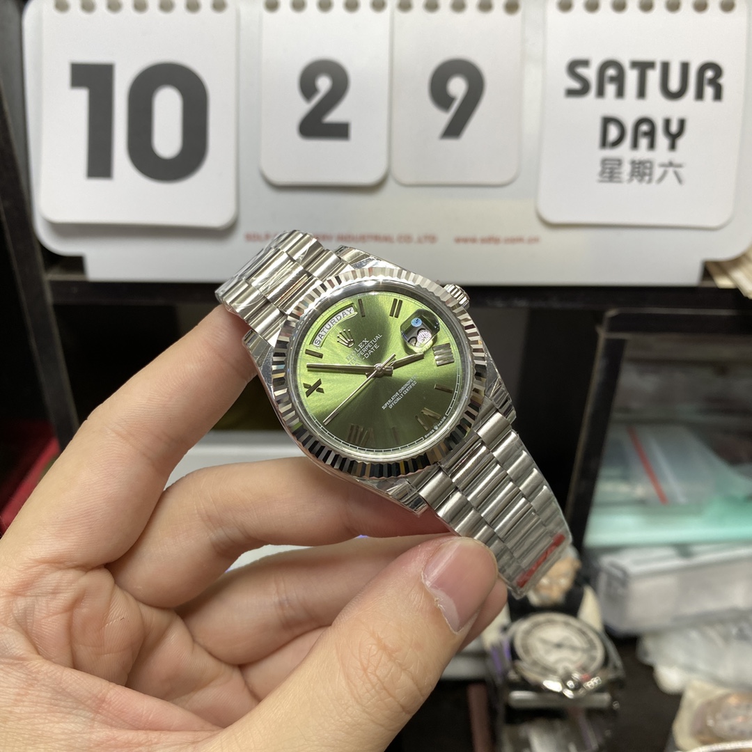 Rolex Day-Date series m228239-0033, Silver Case Olive Green Dial with Roman Numeral Markers, Instantaneous Day and Date Functions, 40mm Size.