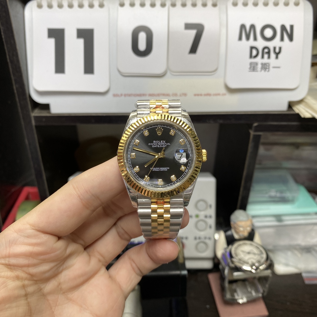 Rolex Datejust series m126333-0006, two-tone gold case black dial with diamond markers and a five-link two-tone gold bracelet, 41mm size.