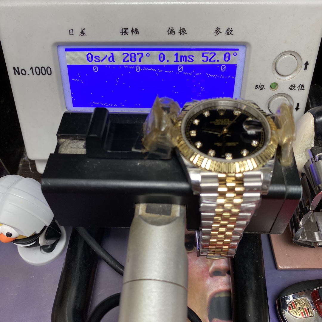 Rolex Datejust series m126333-0006, two-tone gold case black dial with diamond markers and a five-link two-tone gold bracelet, 41mm size.