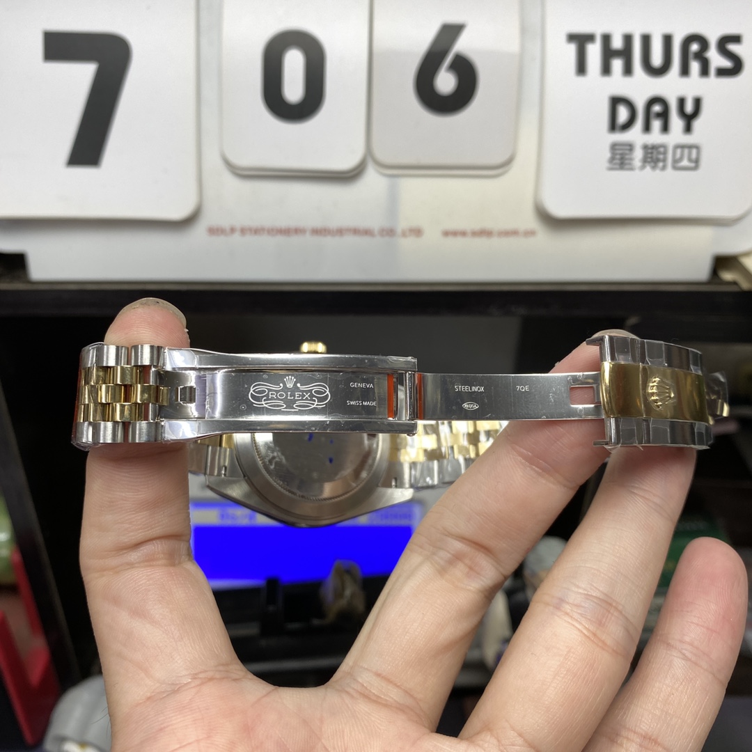 Rolex Datejust series m126333-0006, two-tone gold case black dial with diamond markers and a five-link two-tone gold bracelet, 41mm size.