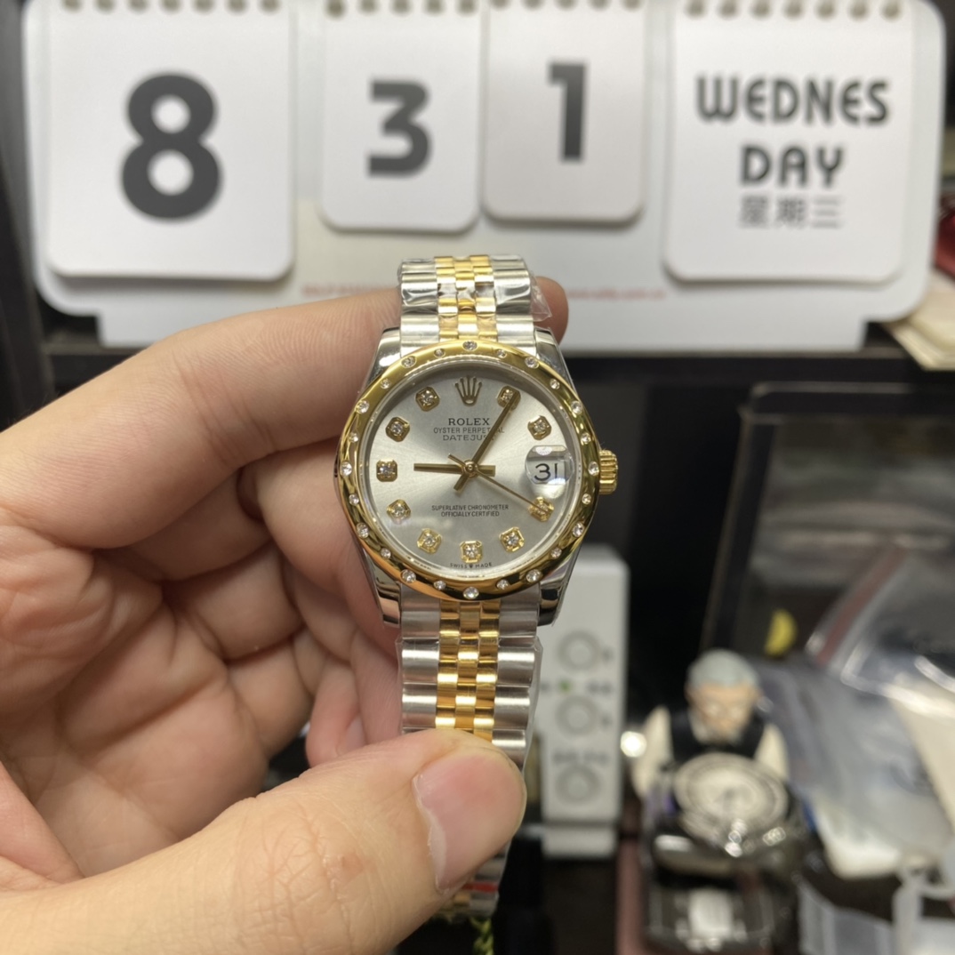 Rolex Datejust Series 178343-63163, Two-Tone Gold Case Silver Dial with Diamond Hour Markers Round Arched Bezel Set with Diamonds, 31mm Size, Five-Link Steel Bracelet.
